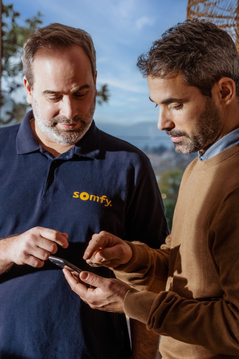 Dealer walking a customer through setup of his new Somfy motorized shades in the app.