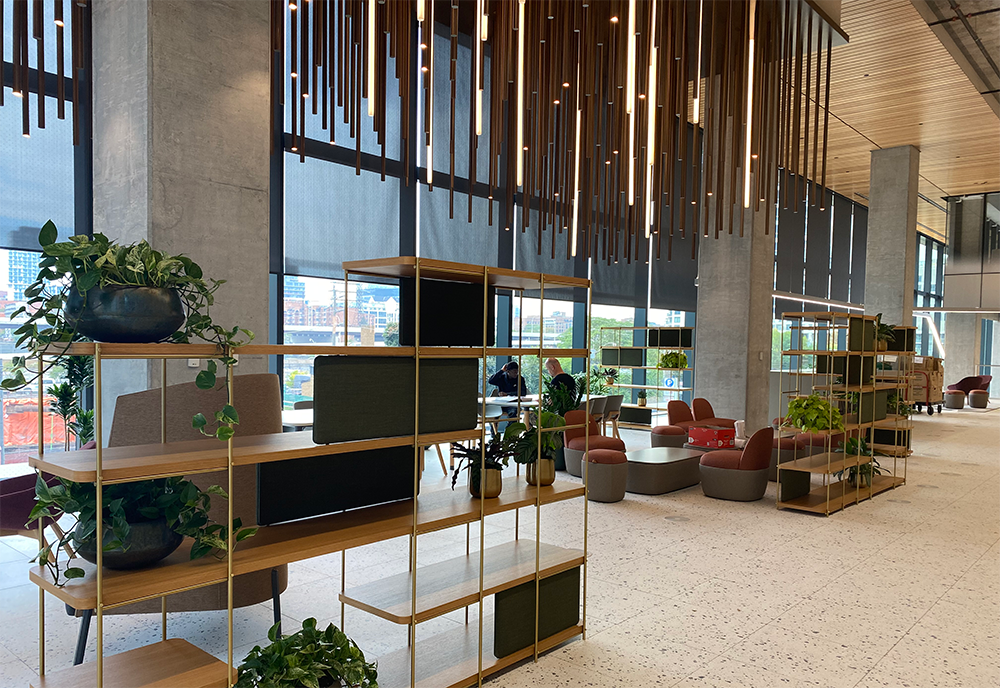 Lobby of the Waterfront Innovation Center showing a sitting area with chairs and shelves.